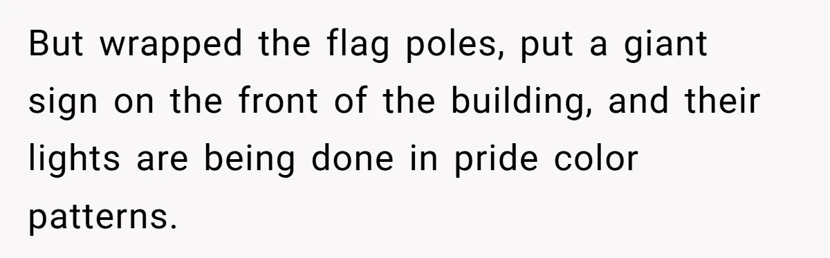 The State Said No Pride Flags. So the City Found a Way to Keep the Colors Anyway But wrapped the flag poles, put a giant sign on the front of the building, and their lights are being done in pride color patterns.